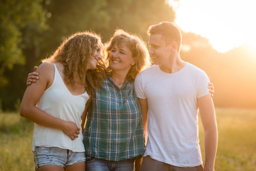 Caucasian family outdoors, spending quality time together.