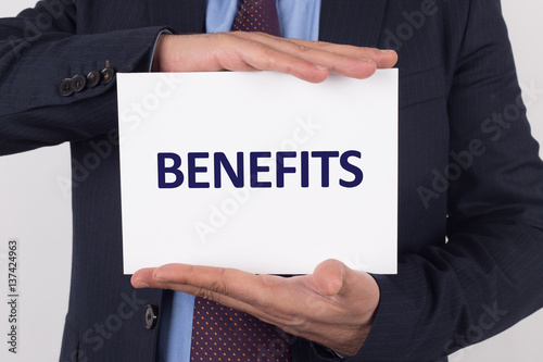 Man showing paper with BENEFITS text