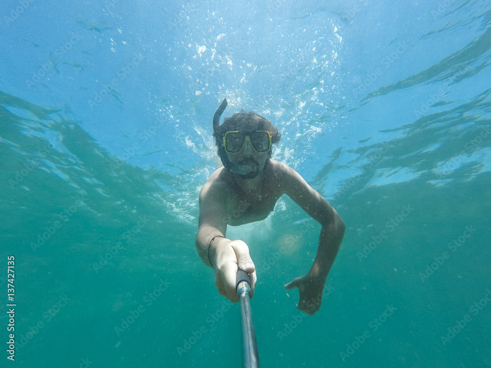 Underwater selfie shot with selfie stick.