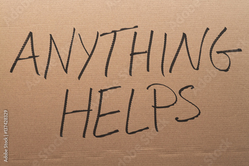 Cuadro en lienzo Thw words Anything Helps written on a carboard sign