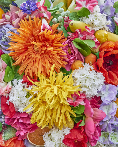 fake orange and yellow flowers closeup  colorful background