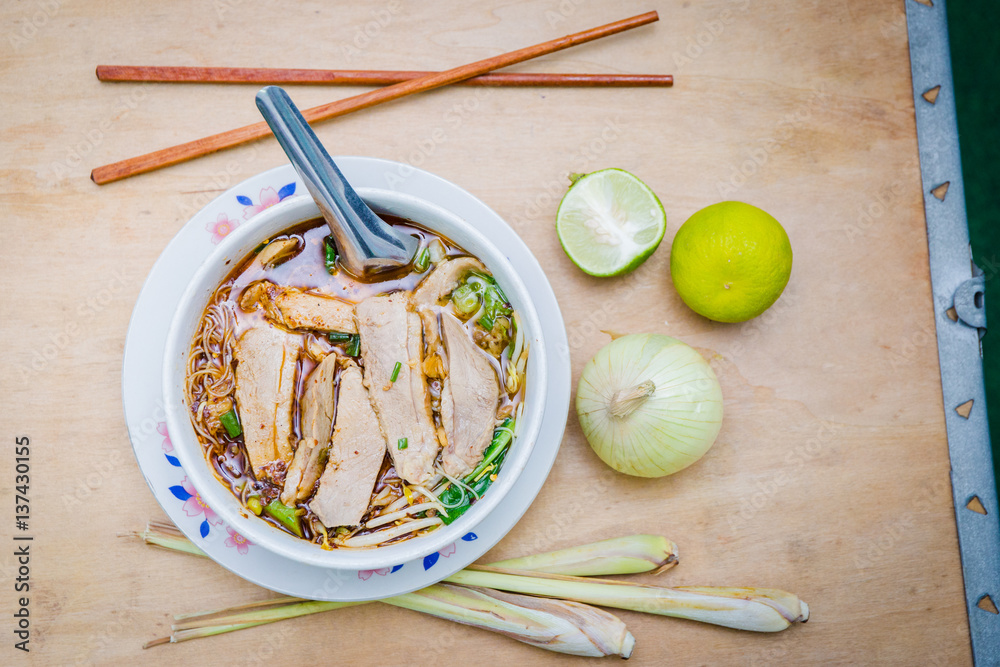 noodle duck with lime and onion on table noodle duck with lime and onion on table