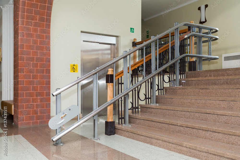 Stair lift for the disabled. Stairs of public building. Stair lift for the disabled. Stairs of public building.