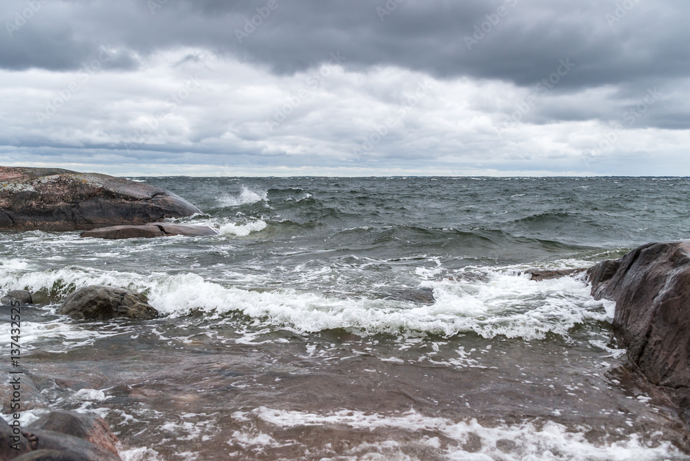 Rough sea crashing on isolated beach.
Rough sea crashing on isolated beach.