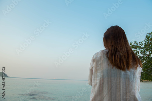 young woman on the beach,sad concept