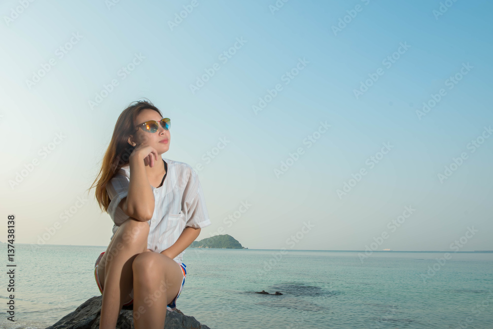 young woman on the beach and be sad concept young woman on the beach and be sad concept