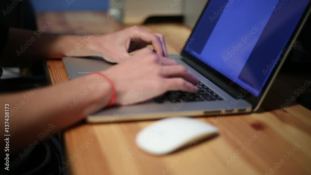 Businessman hands typing on a laptop keyboard, working with NoteBook in the desk office -Dan Businessman hands typing on a laptop keyboard, working with NoteBook in the desk office -Dan