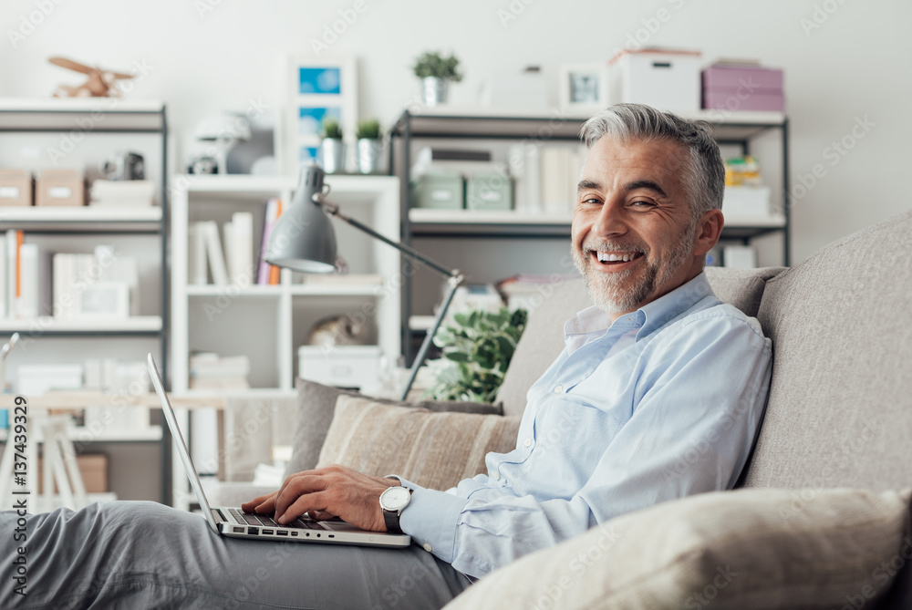 Cheerful businessman working at home Cheerful businessman working at home