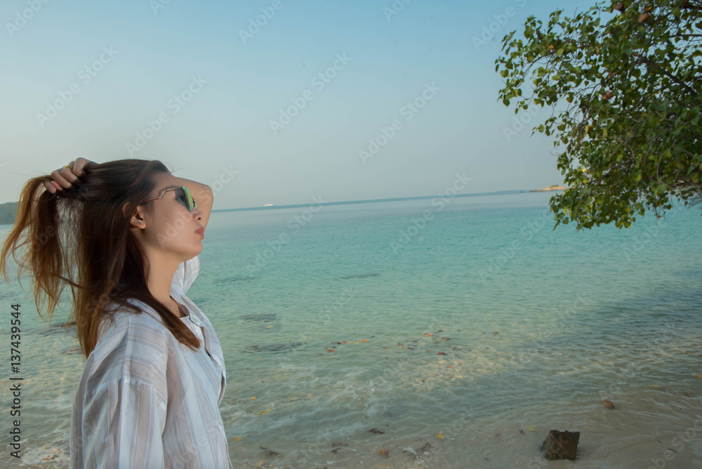 young woman on the beach and be sad concept young woman on the beach and be sad concept