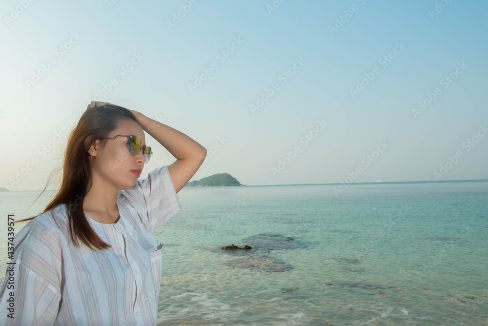 young woman on the beach and be sad concept young woman on the beach and be sad concept