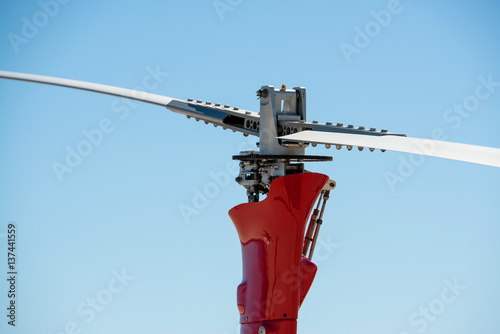 A gyrocopter (autogyro, gyroplane, rotaplane, helicopter) propeller closeup with blue sky on the background. photo