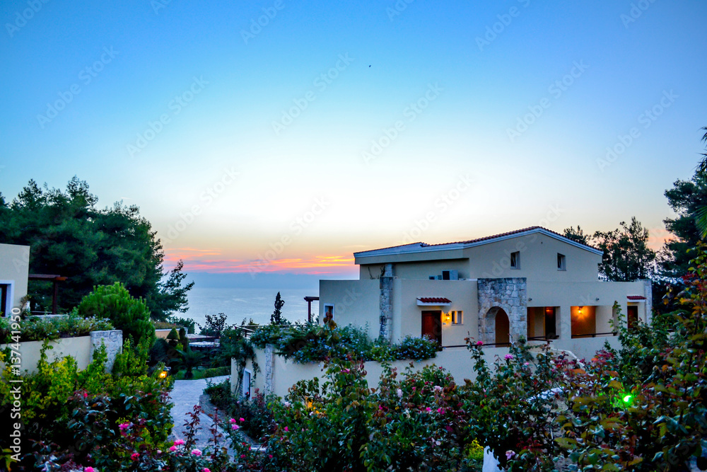 Fototapeta premium Dawn at the sea. luxury Greek hotel Aegean Melathron, Greece - September, 2013.