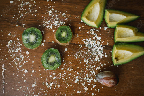Fresh kiwi, avocado on the desk. Healthy eating.