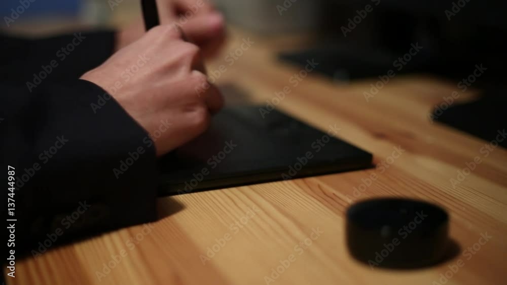 Male Boss hands using computer keyboard and graphics tablet for sign an agreement -Dan Male Boss hands using computer keyboard and graphics tablet for sign an agreement -Dan