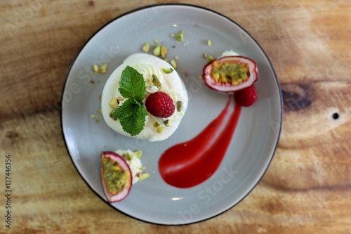 French dessert: ice cream, meringue and rasberry coulis - vacherin dessert photo