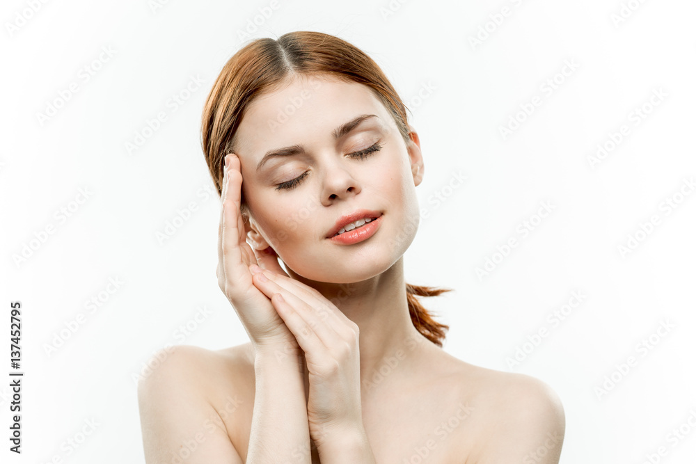 red-haired woman with closed eyes put her hands near her face red-haired woman with closed eyes put her hands near her face