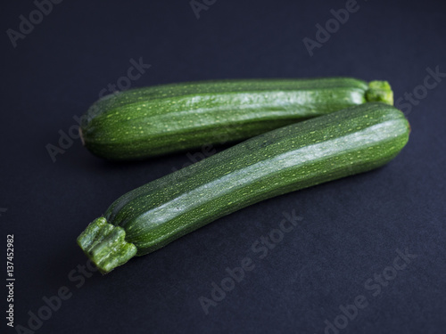 Zucchini isolated on black