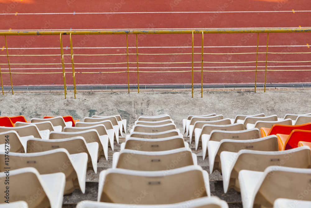 Obraz premium Empty plastic seats at stadium