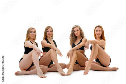 Female sporty dance group posing in studio