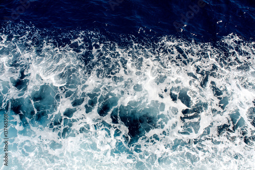 Blue sea waves with a lot of sea foam © zoranlino