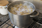 cooking pasta in metallic pot