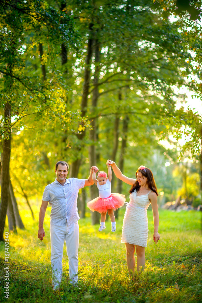 Fototapeta premium Happy family in the evening park