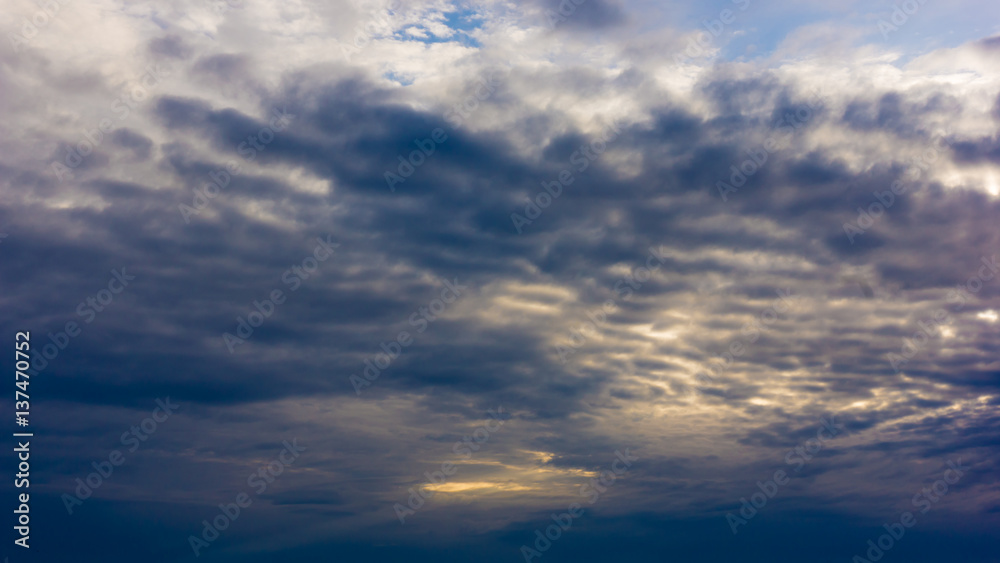 Beautiful cloudy sky with sun rays. Dramatic sky with stormy clouds