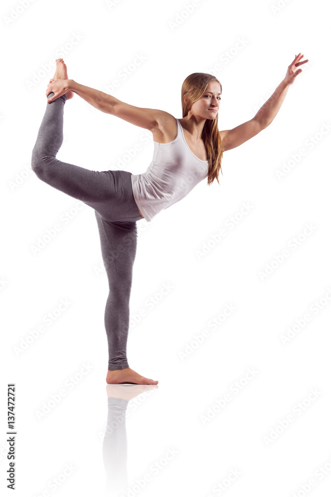 Obraz premium Beautiful woman doing stretches, isolated on white
