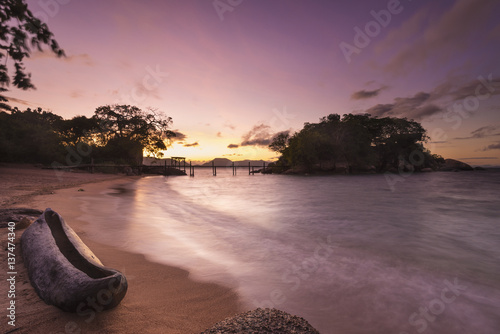 Dugout canoe on small beach on Mumbo Island, Lake Malawi; Malawi photo