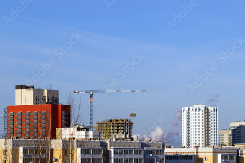 Tower cranes on a background of urban development