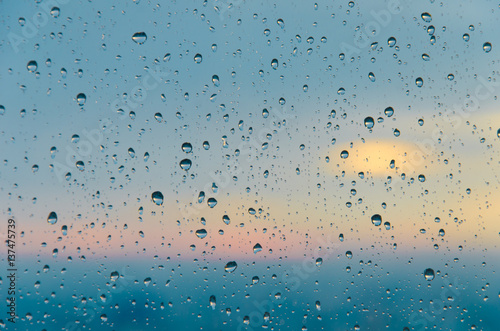 bokeh blur rain drop on glass rainy season