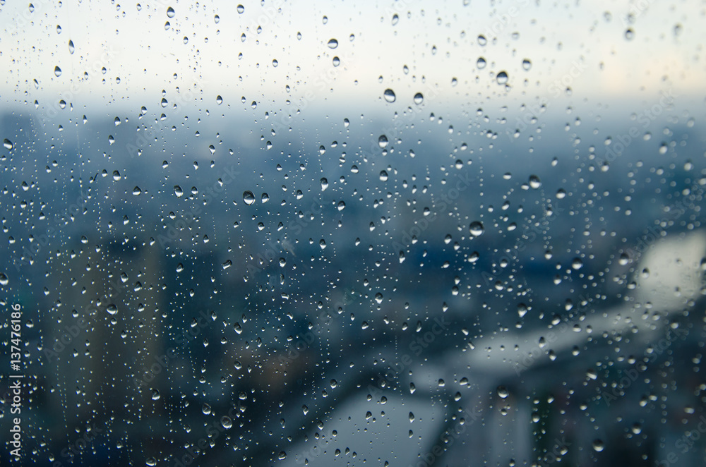 bokeh blur rain drop on glass rainy season