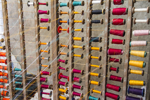 Yarns at a lurik workshop in Cawas village, Klaten, Central Java, Indonesia photo