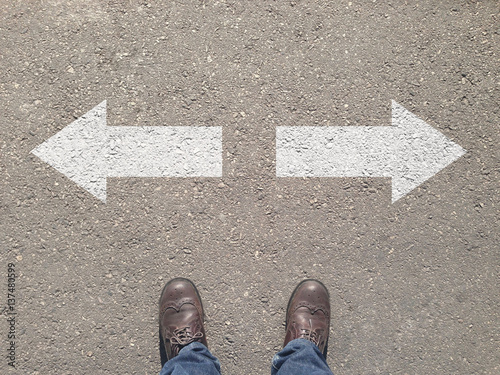standing at the crossroad making decision which way to go