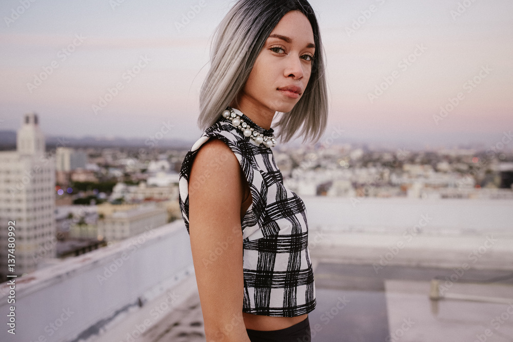 Portrait of a young woman on rooftop
