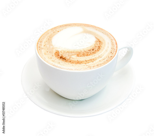 Top view of hot coffee cappuccino with cinnamon spiral foam isolated on white background, close up.