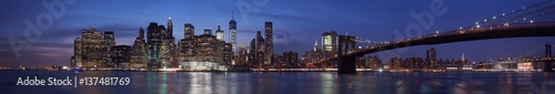 New York city skyline with Brooklyn bridge panorama at dusk  natural colors