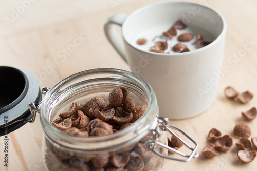 chocolate cereal cornflakes and milk for breafast photo