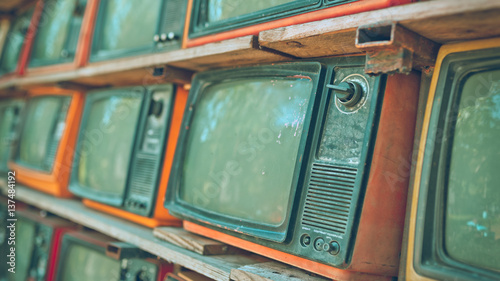 A Stack of retro televisions in vintage style.
