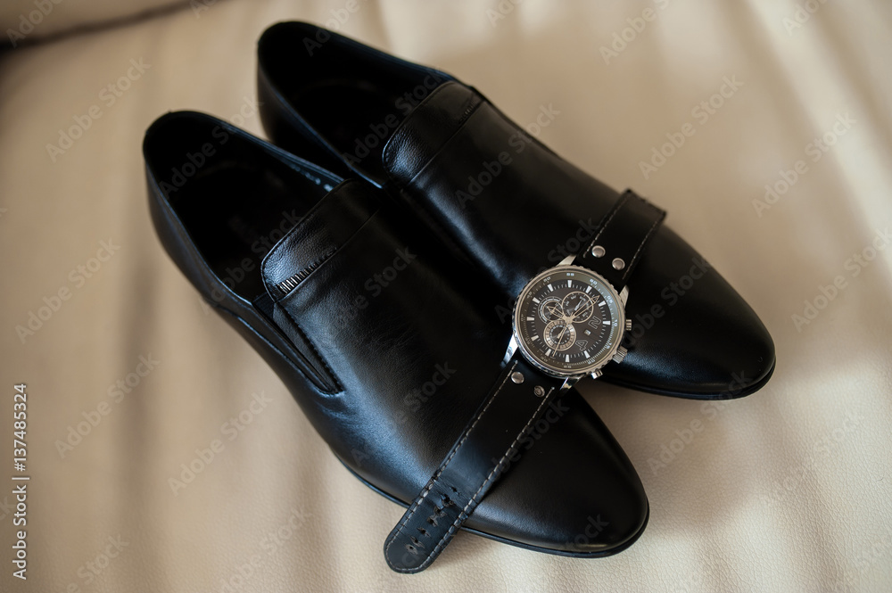 Black men's shoes and watches