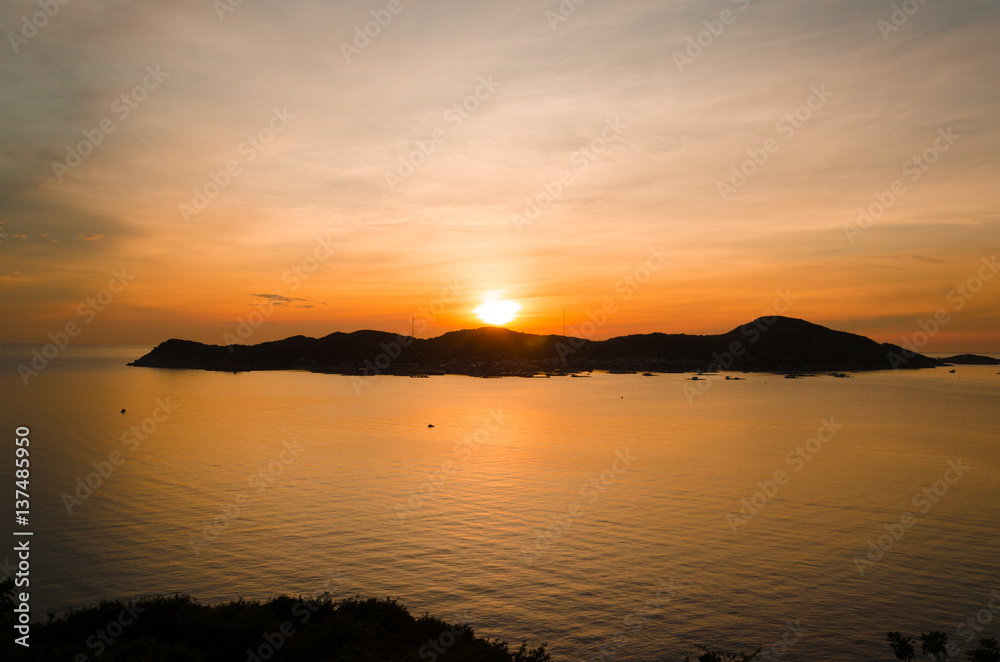 Sun rises over Binh Hung island, Cam Ranh, Vietnam