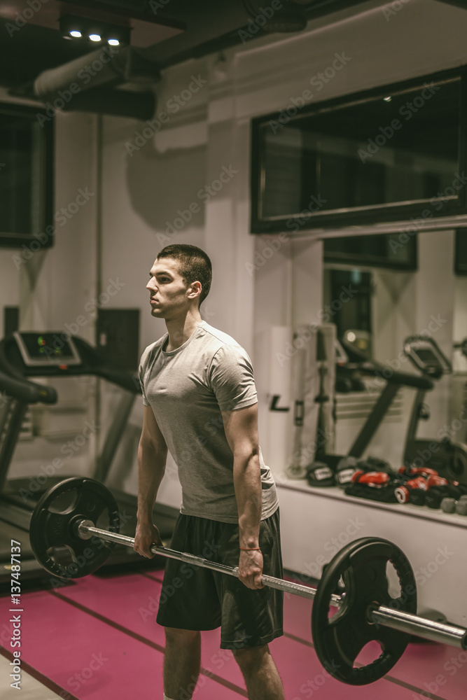 Strong man working out at gym fitness club Strong man working out at gym fitness club