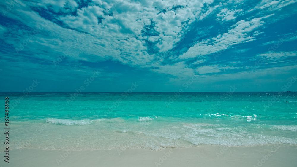Beautiful sea sand beach blue sky scenery background.