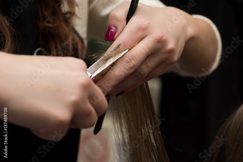 Female hair cutting scissors in a beauty salon