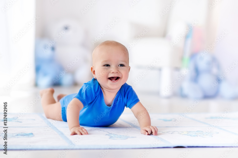 Baby boy playing and learning to crawl Baby boy playing and learning to crawl