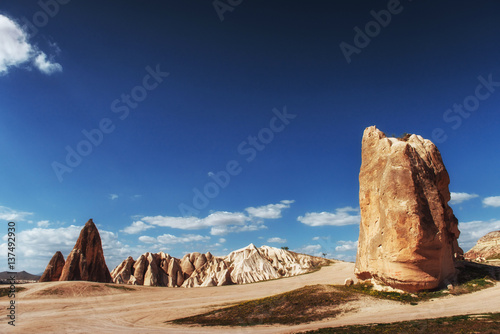 Beautiful Cappadocia on the background of blue sky with white