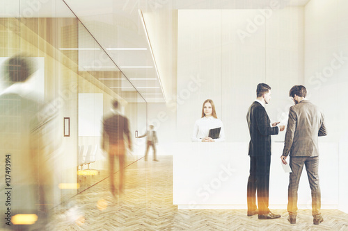 Business people in a wooden hall, toned