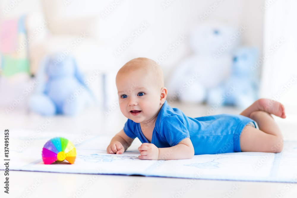 Baby boy playing with toy ball Baby boy playing with toy ball