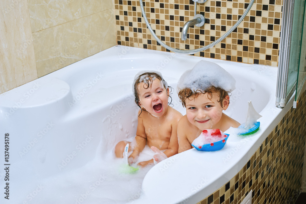 brother and sister fun take water treatments. Children in the bathroom