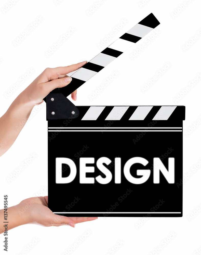 Hands holding a clapper board with DESIGN text